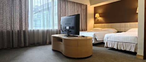 Deluxe Triple Room, City View | Desk, laptop workspace, free WiFi