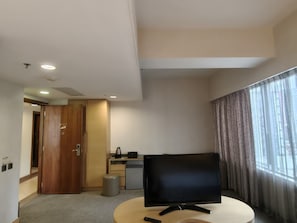 Deluxe Triple Room, City View | Desk, laptop workspace, free WiFi