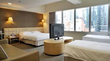Deluxe Quadruple Room, City View | Desk, laptop workspace, free WiFi