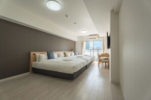 A modern hotel room with a large bed, a desk, and a city view. - ESLEAD HOTEL Namba Kuromon (Osaka)
