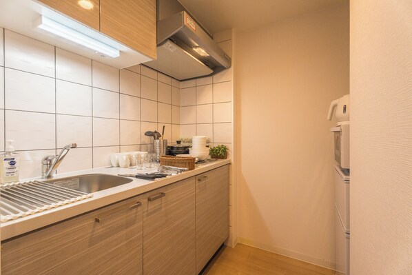 Exclusive Apartment, Lanai, City View | Private kitchen | Full-size fridge, microwave, stovetop, cookware/dishes/utensils