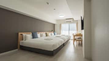 Deluxe Triple Room, Lanai, City View | Living area | Flat-screen TV