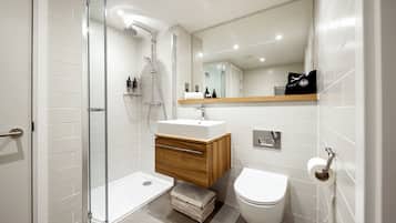Shower, rainfall showerhead, hair dryer, towels