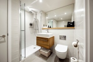 Shower, rainfall showerhead, hair dryer, towels