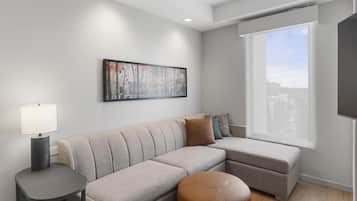 Desk, laptop workspace, blackout drapes, bed sheets