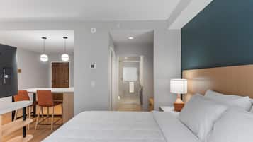 Desk, laptop workspace, blackout drapes, bed sheets