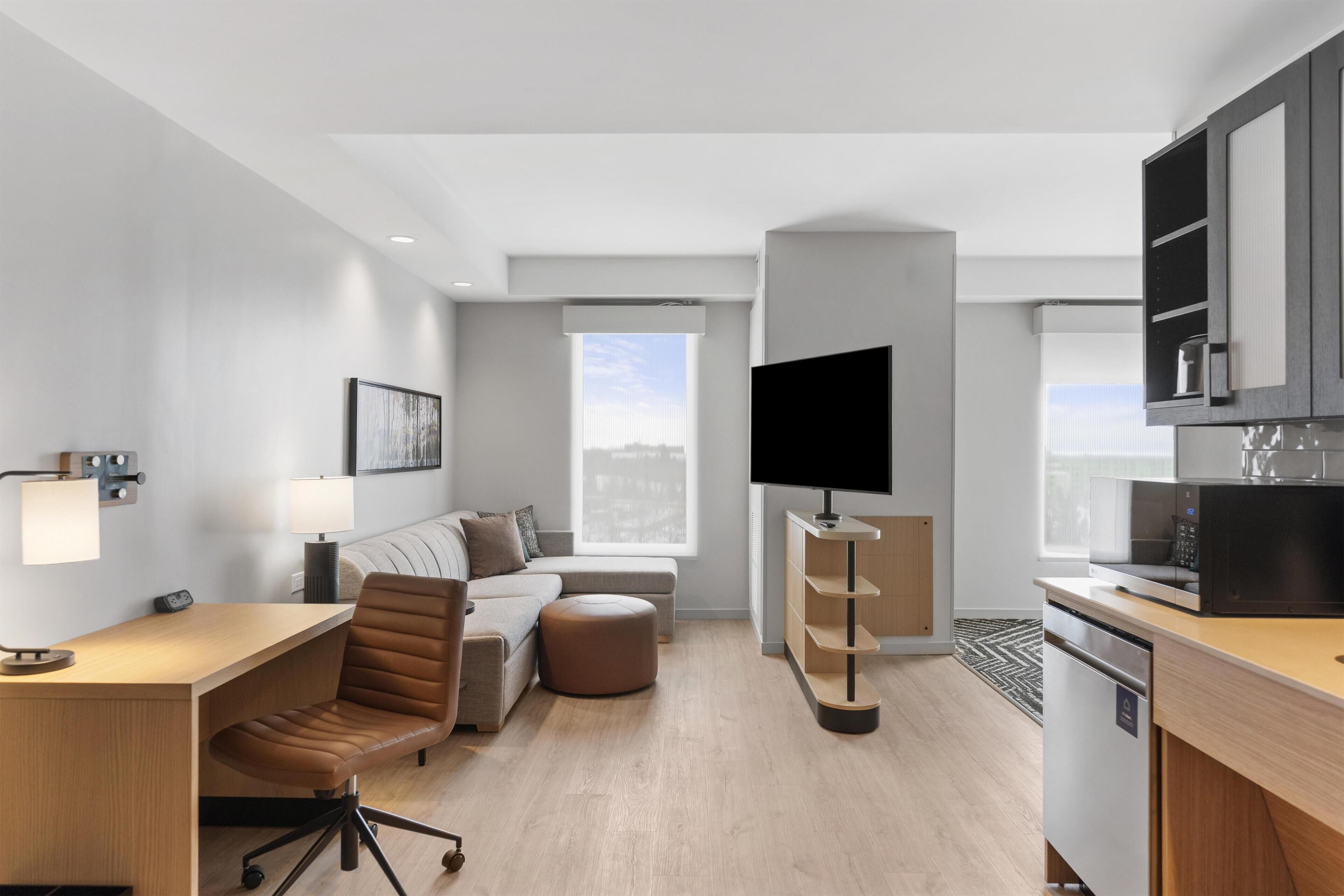 Desk, laptop workspace, blackout drapes, bed sheets
