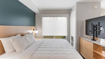 Desk, laptop workspace, blackout curtains, bed sheets