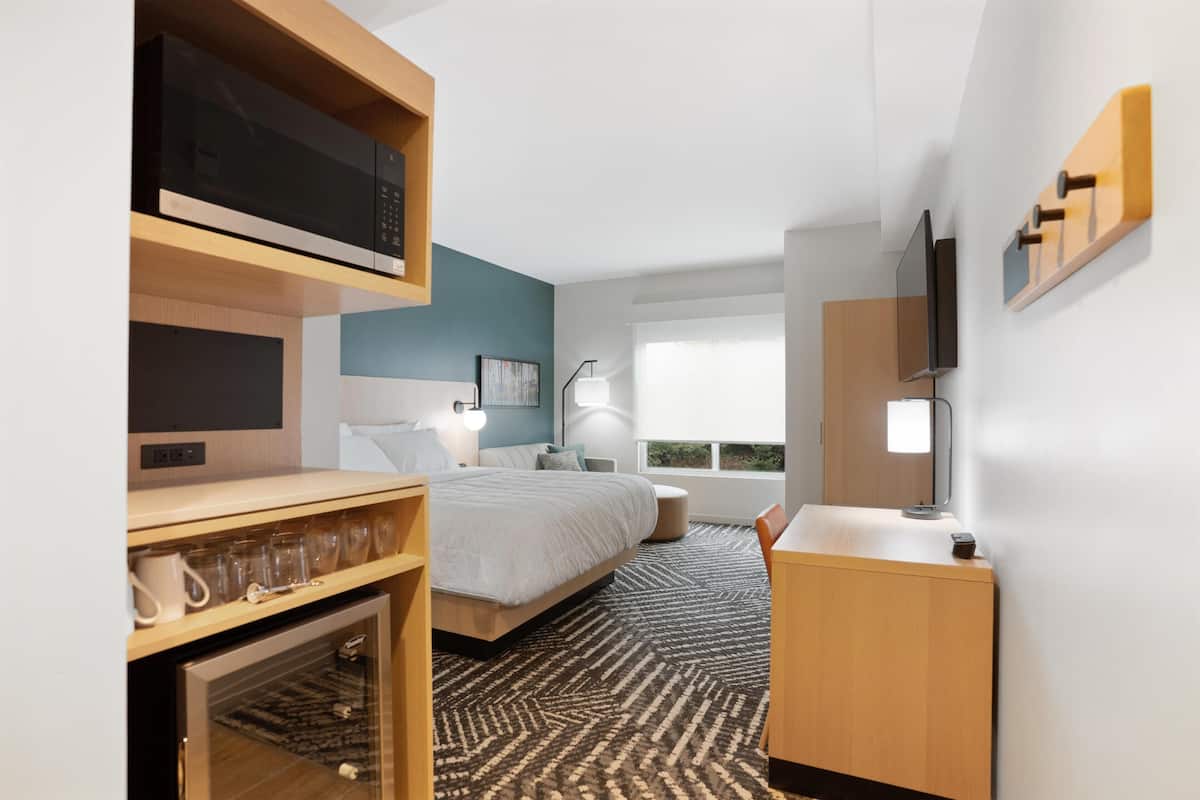 Desk, laptop workspace, blackout curtains, bed sheets