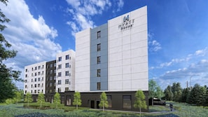 A modern hotel building with a prominent 'HYATT house' sign, multiple floors, and a landscaped front yard with trees and a pathway.