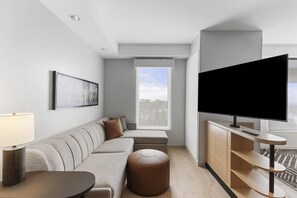 Desk, laptop workspace, blackout curtains, bed sheets