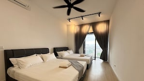 A hotel room with two beds, a ceiling fan, and a large window with curtains. - The Pano Green Sentul Park (Kuala Lumpur)