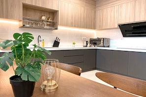 Deluxe Apartment, 2 Bedrooms, Balcony, City View | In-room dining