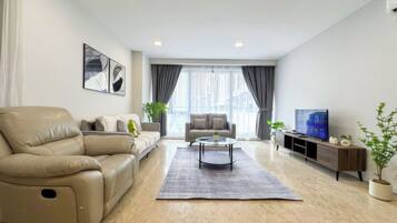 Superior Apartment, 3 Bedrooms, Kitchen, City View | Living area | 35-inch TV with cable channels, offices