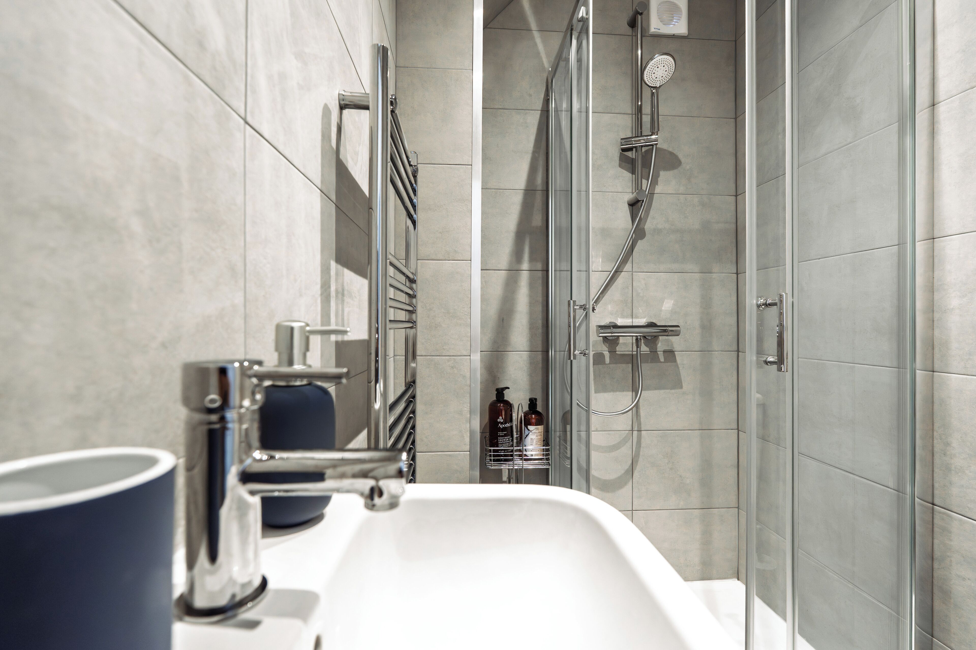 Shower, hair dryer, towels, soap