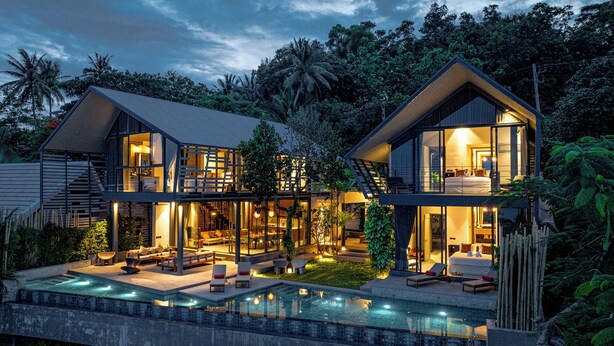 A modern two-story house with a swimming pool, large windows, and a well-lit interior. - Hin Butik Villa 4BR Private Seaview (Koh Samui)