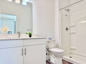 Shower, hair dryer, towels, shampoo