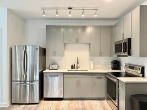 Fridge, microwave, oven, stovetop - Modern 2B2B Downtown ATL Condo! Free Street Parking! (Atlanta)