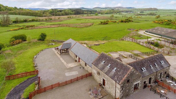 A rural property with a stone building, a fenced courtyard, and expansive green fields. - 3 bedroom accommodation in near Gatehouse of Fleet (near Gatehouse of Fleet)