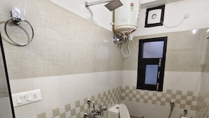 A bathroom with a toilet, bidet, and sink. - OnlyStay Silicon Inn Shimla (Shimla)