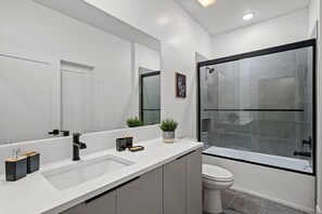 Shower, hair dryer, towels, shampoo