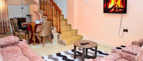 Comfort Apartment | Living area | 24-inch Smart TV with digital channels