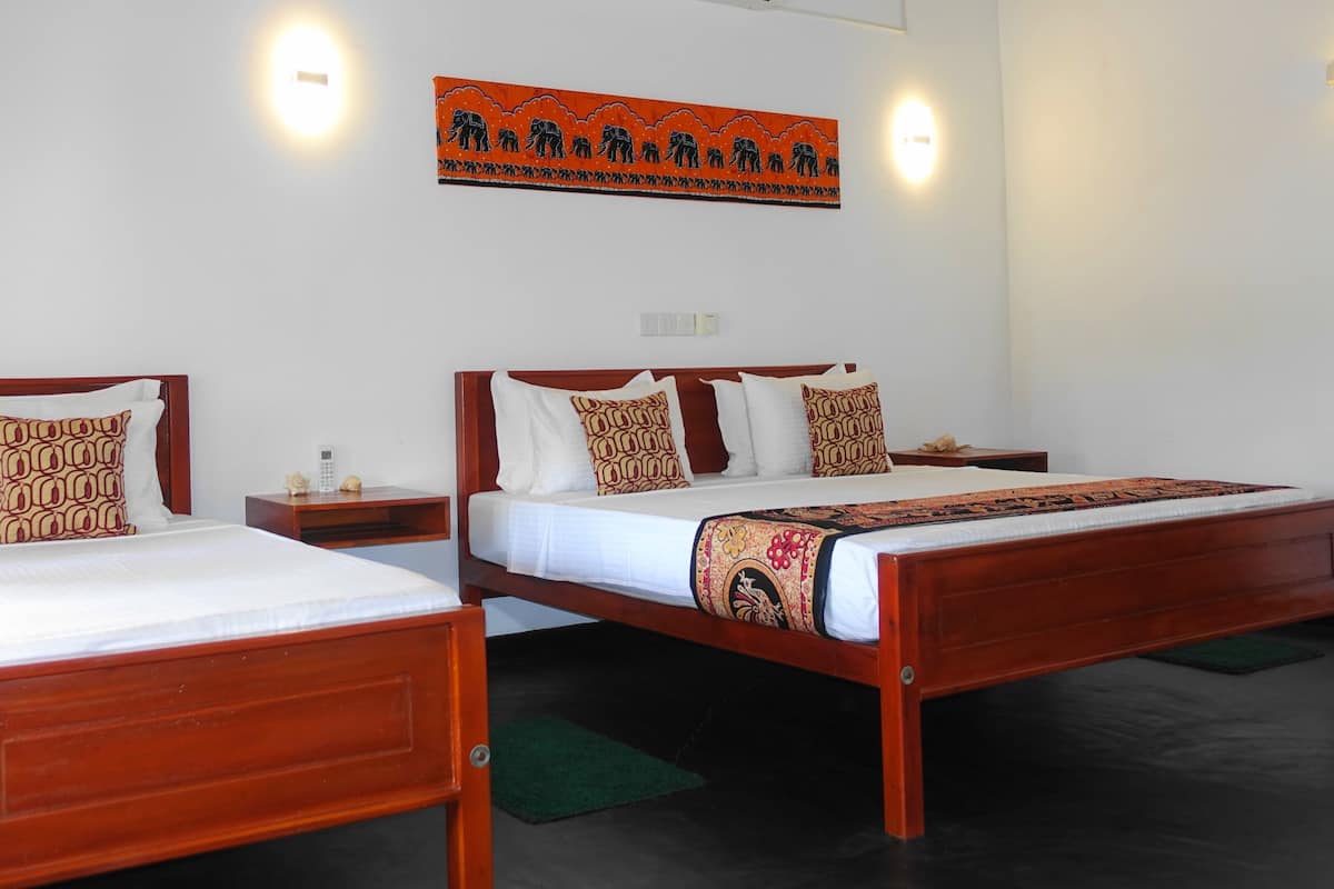 Deluxe Triple Room, Balcony, Garden View | Desk, free WiFi
