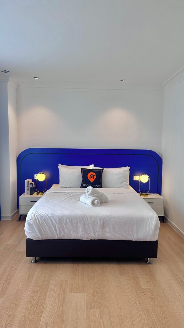 Suite Deluxe, vistas a la ciudad | Tabla de planchar con plancha y wifi gratis