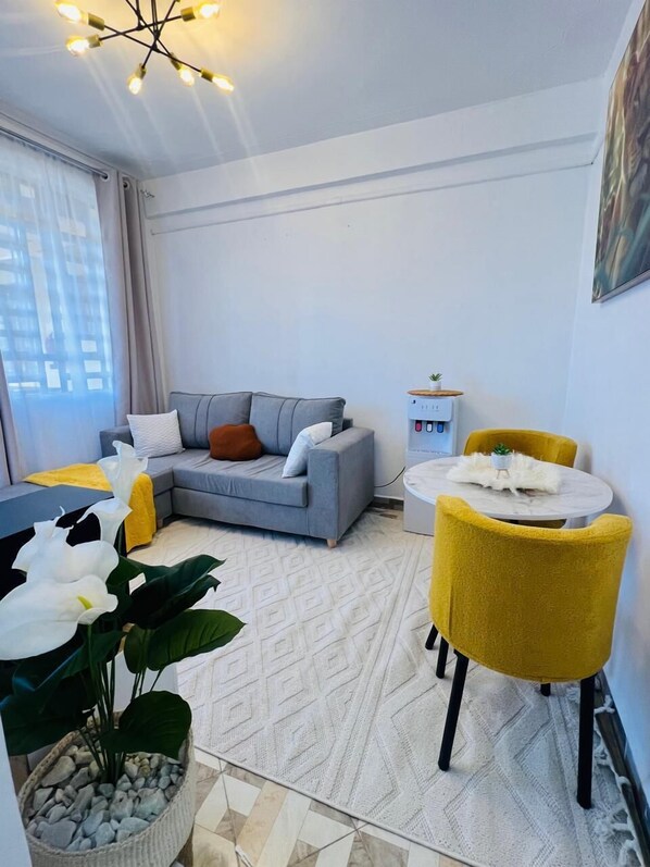 Classic Apartment, City View | Living area | 32-inch Smart TV with digital channels