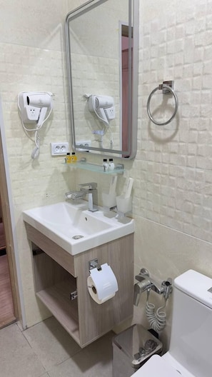 Shower, hair dryer, towels, soap