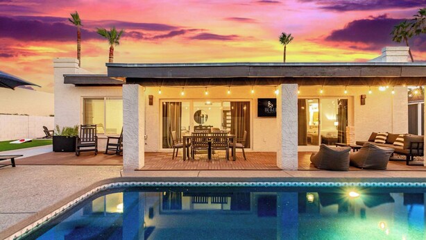 A poolside area with a covered seating area, a pool, and a sunset view. - NEW|The Bungalow @ Old Town|Al-Fresco Living|Pool (Scottsdale)