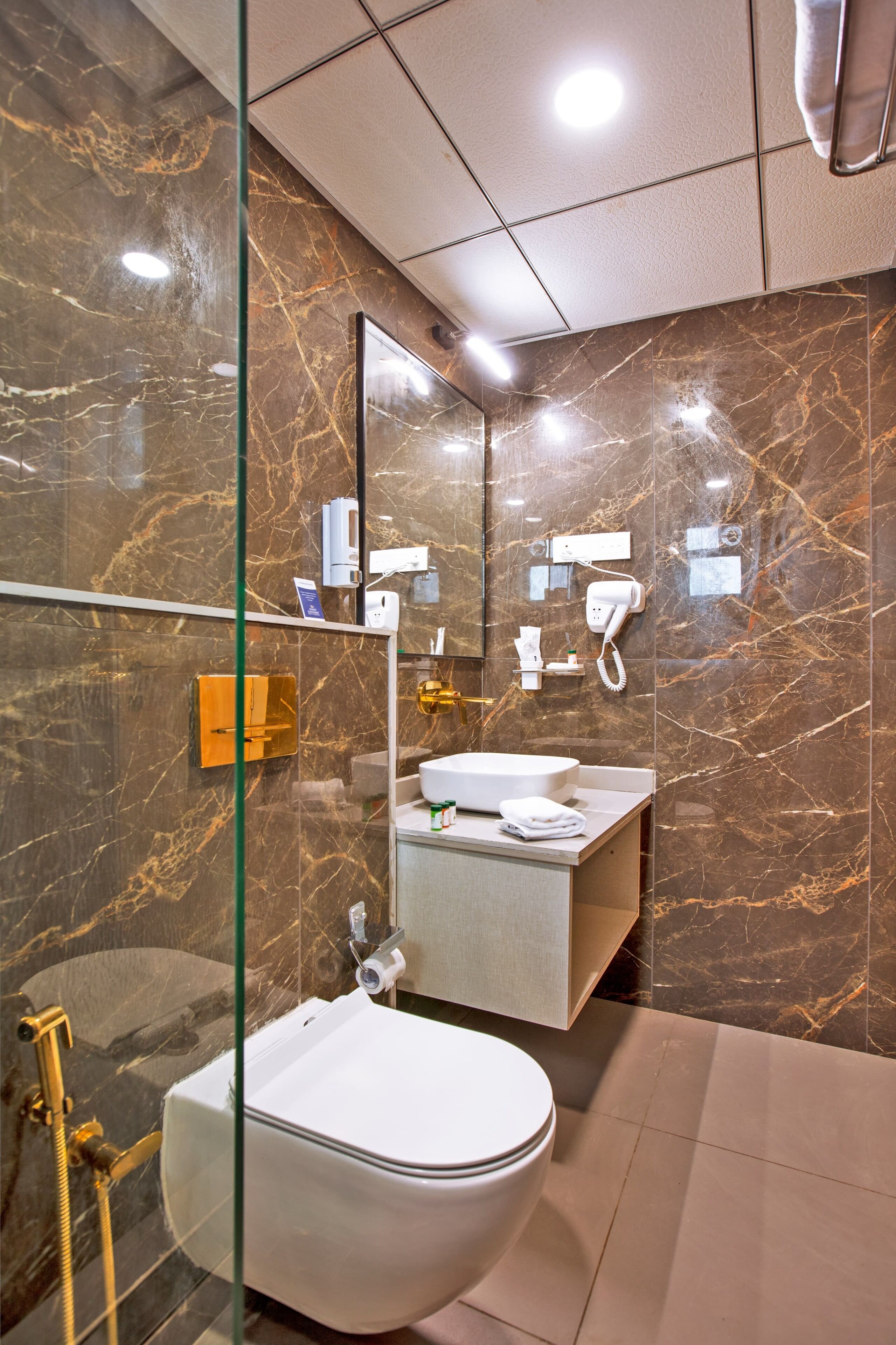 Shower, hair dryer, slippers, towels
