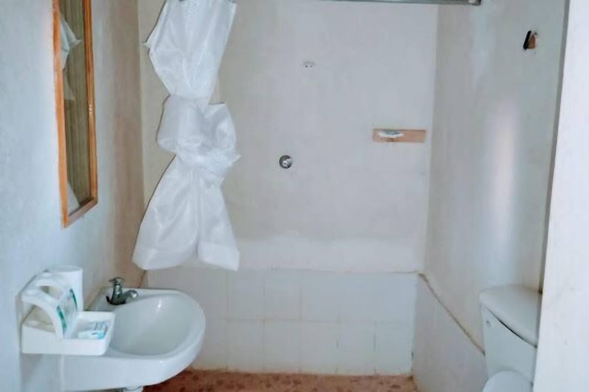 Shower, slippers, towels, soap