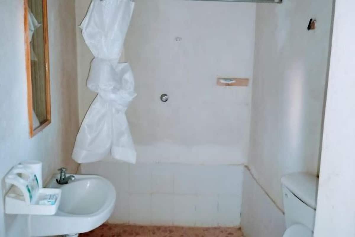 Shower, slippers, towels, soap