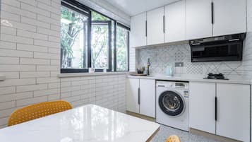 Suite, 2 Bedrooms | Private kitchen | Fridge, microwave, rice cooker, cookware/dishes/utensils