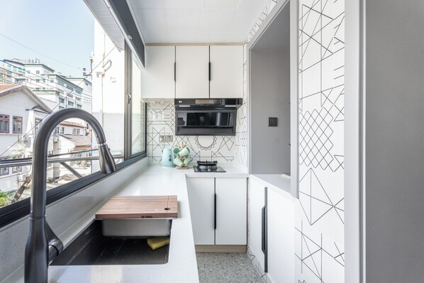 Suite, 2 Bedrooms | Private kitchen | Fridge, microwave, cookware/dishes/utensils, paper towels