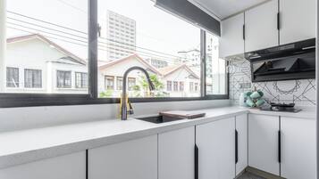 Suite, 2 Bedrooms | Private kitchen | Fridge, microwave, cookware/dishes/utensils, paper towels