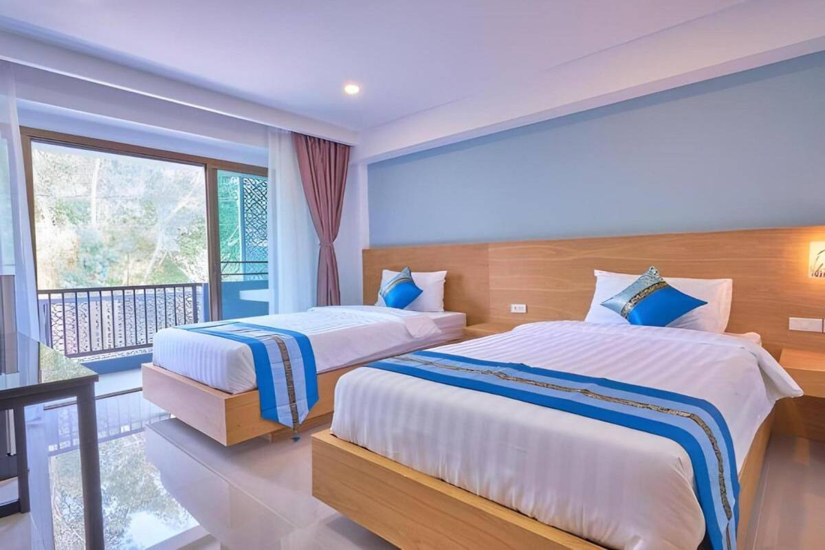 ห้องดีลักซ์ทริปเปิล | Wi-Fi ฟรี, ผ้าปูที่นอน