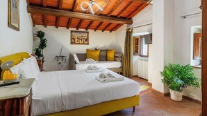 A hotel room with a bed, a desk, a chair, a TV, and a window. - Borgo Antico (Barberino di Mugello)