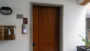A wooden door with a keycard reader and a sign indicating a vacant room.