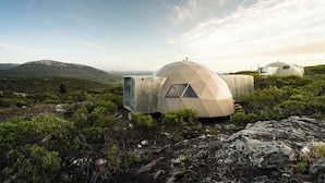 A geodesic dome structure in a natural landscape with a clear sky. - Piedra de las Animas (Nueva Carrara)