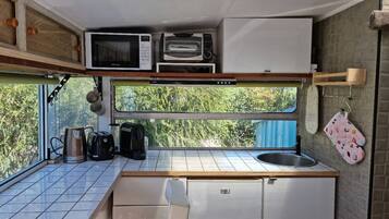 Fridge, coffee/tea maker, cookware/dishes/utensils