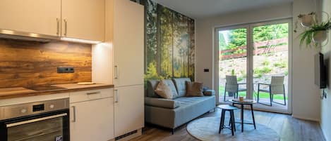 Departamento, vista al jardín | Área de sala de estar
