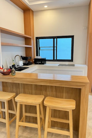 Microwave, stovetop, dishwasher, dining tables