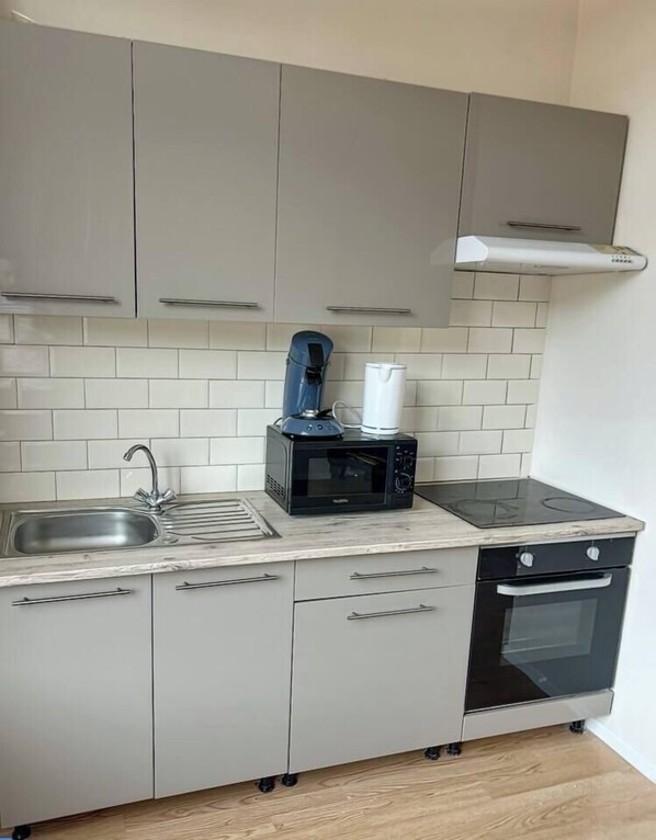 Fridge, microwave, cookware/dishes/utensils