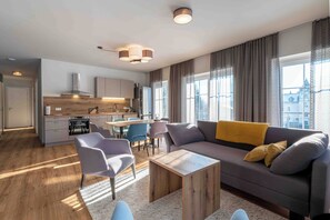 Comfort Apartment, 2 Bedrooms, Mountain View | Living area | 50-inch flat-screen TV with cable channels - THE SINGULAR (Bad Goisern)