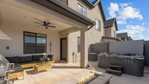 A patio with a fire feature, outdoor seating, and a hot tub. - Adventure Basecamp: Hot Tub + Resort Amenities (Washington)