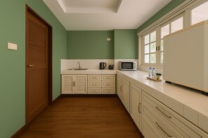 Mini-fridge, microwave, electric kettle, cookware/dishes/utensils