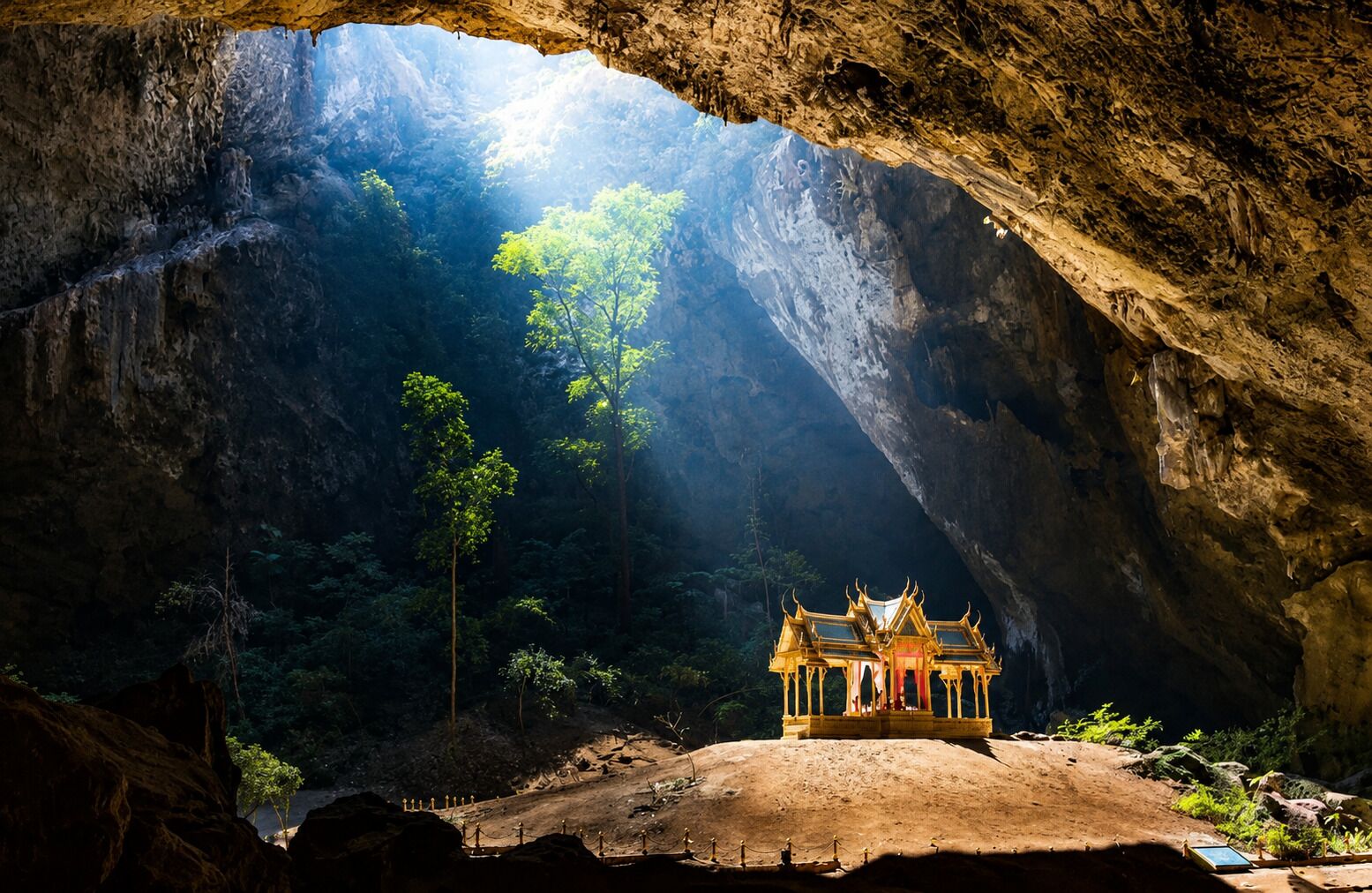 A cave with a temple structure at the bottom.