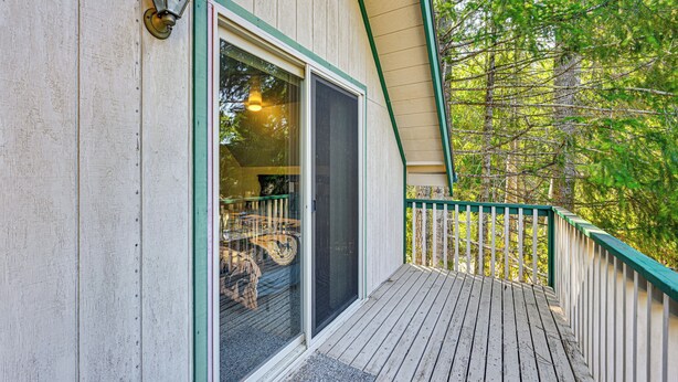 A wooden deck with a glass door leading to a room. - 2 Mi to Lake Cushman Access: PNW Cabin Retreat! (Hoodsport)